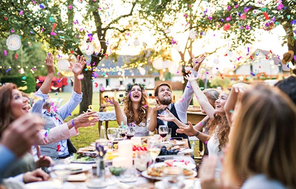 Backyard wedding at table: wedding insurance